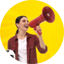 Person holding soccer ball and talking into a megaphone.