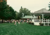 Pavillion field with bandstand hosting a show at AppleFest 2024