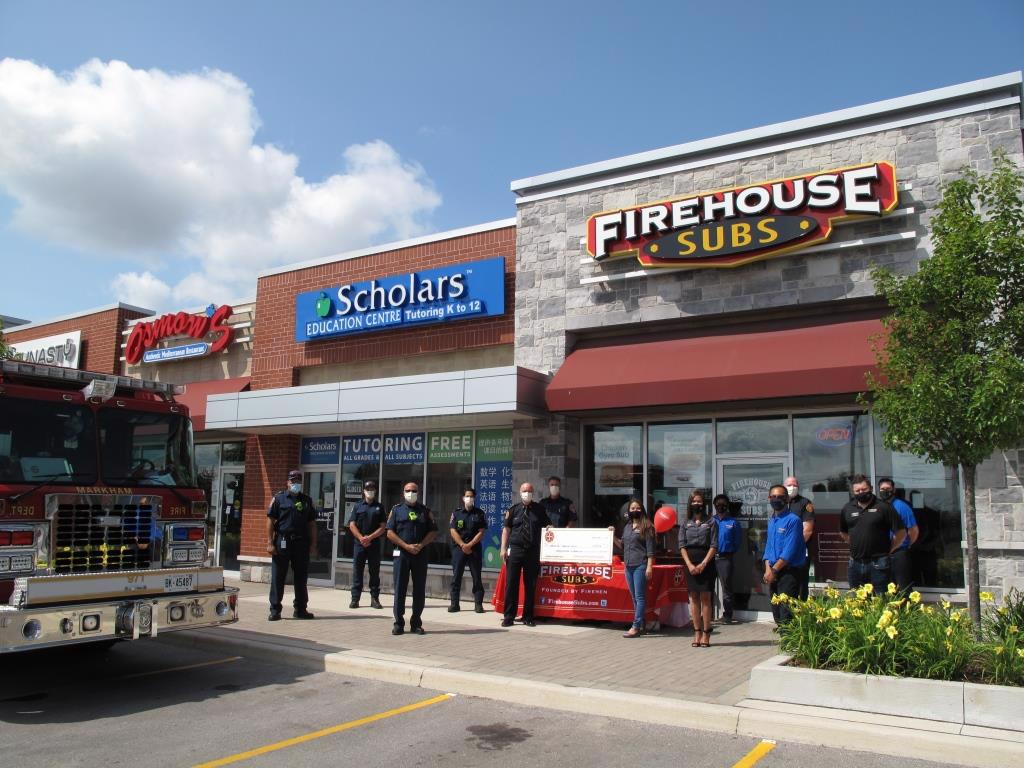 Markham Fire and Emergency Services firefighters receiving the Firehouse Subs Public Safety Foundation of Canada grant