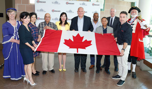 Mayor Frank Scarpitti with Canada Day Co-Chairs Councillor Amanda Collucci and Councillor Alex Chiu, Jonathan Michael, Town Crier John Webster and Markham's Canada Day sponsors.