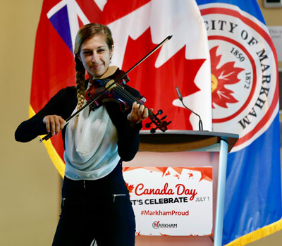 Electric violinist, Daniela Di, plays 'Lean On' at Markham's Canada Day News Conference. She will perform live on stage at Milne Dam Conservation Park on July 1 as part of Markham's Canada Day celebrations.